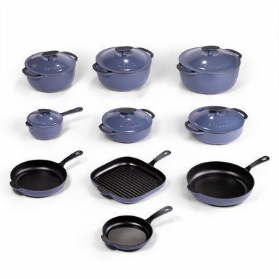 Blue enameled cast iron cookware set with 22 pieces from BUCHYMIX NIGERIA, including pots, pans, and lids, on a kitchen countertop.