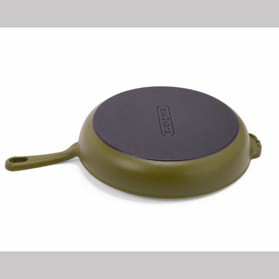Green enameled cast iron skillet from BUCHYMIX NIGERIA, durable cookware with a smooth, vibrant green enamel finish.